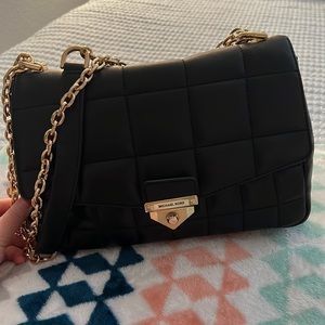 black Michael Kors with gold chain